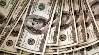 Dollar edges down on black market