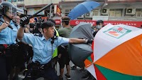 Batons used as Hong Kong police and protesters scuffle near Chinese border