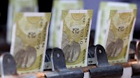 Rupee slips as Asia FX rally cools; correlation with yuan tightens