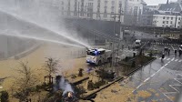 Protesting farmers spray Brussels police with liquid manure near EU's base in a new display of power