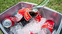 Coca-Cola says it will use U.S. cane sugar in a new Coke, a plan pushed by Trump