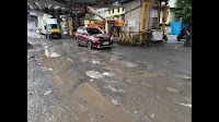 Rain damaged roads bring Chennai to a halt