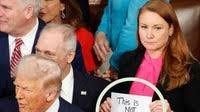 Democratic Rep Reveals ‘SOS’ Message Behind Her Viral ’NOT Normal’ Sign At Trump Speech