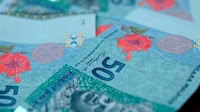 Ringgit weakens against USD, gains on other major currencies