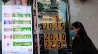 Mexican peso pares losses, remains volatile on US recession fears