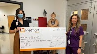 Piedmont Walton donates funds to Walnut Grove High School for AED