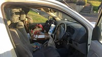 A New Zealander lives here, sleeping upright in the driver’s seat. He’s 64
