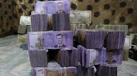 Exclusive-Syria to revalue currency, dropping two zeros in bid for stability