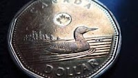 The Canadian dollar is diving against other major currencies despite gaining against the greenback