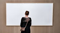 A Danish artist has been ordered to repay a museum after delivering blank canvases
