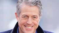 Hugh Grant settles claim against Sun publisher due to risk of £10m legal costs