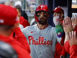 Harper leads Phillies past Braves to stop 10-game losing streak
