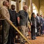Mourners pack emotional vigil victims