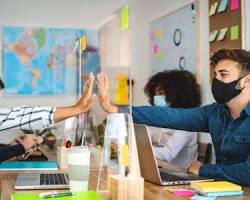 Image of business team working together during a pandemic