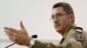 Lt.-Gen. Andre Deschamps, chief of Canada&#39;s air staff, gestures while answering questions from the media following a statement regarding the trial of former ... - image