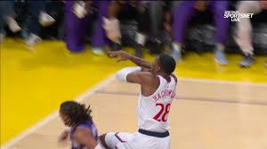Matisse Thybulle with the massive block at the rim