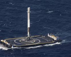 Image of SpaceX Falcon 9 first stage landing on a drone ship