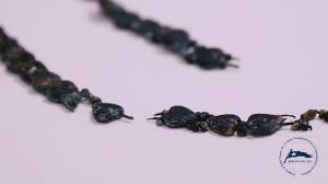 Titanic's Rare Black Glass Necklace Restored and Revealed