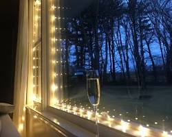 Image of fairy lights strung across a window