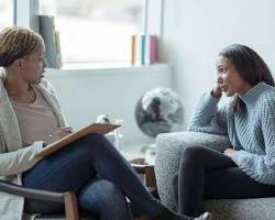 Image of Person talking to a therapist