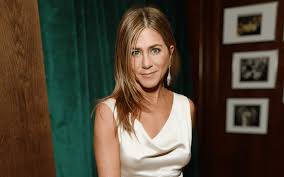 How Jennifer Aniston’s Cinched Dress Blossoms with the Colors of Spring