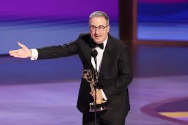 John Oliver Gets Played Off During Emmys Speech While Honoring His Family’s 
Dead Dog: ‘F— You, There You Go!’