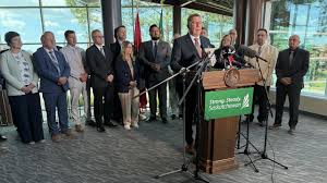 Premier Scott Moe announces retaliatory tariffs on U.S. booze, won't pull liquor from shelves - CBC