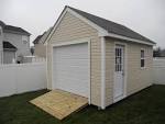 Storage shed with garage door