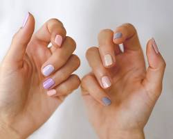 Medium skin with pastel nail polish