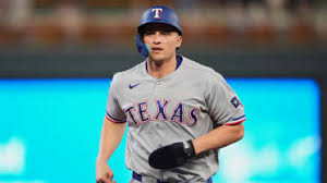 Corey Seager on the baseball field, wearing his team uniform.