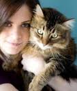 maine coon : A young woman holding her pet Maine Coon cat. A young woman holding her pet Maine.. #9856097 - 9856097-a-young-woman-holding-her-pet-maine-coon-cat