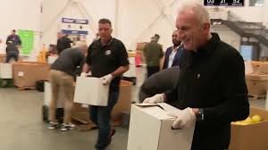 Joe Montana volunteering to feed the hungry