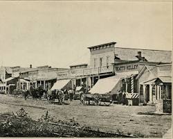 Image of Dodge City, Kansas, in the late 1870s, a bustling frontier town with wooden buildings, dirt streets, and cattle drives