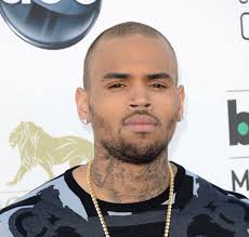 The 24-year old singer wore a black and grey Versace printed sweater, black washed denim jeans, and Giuseppe Zanotti sneakers. - Chris-Brown-wears-Versace-sweater-and-Giuseppe-Zanotti-sneakers-at-2013-Billboard-Music-Awards-4