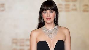 Dakota Johnson Fuels Dating Rumors With Rapper in Outing Video