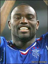 Jean-Claude Darcheville claps the Rangers fans. Eddie Murphy&#39;s career has suffered since his Ibrox move - _44588252_eddie_murphy270