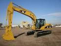 CAT 320C Excavator loading trucks -