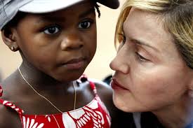 US pop star Madonna holds her adopted Malawian child Mercy James - 2584688-3x2-940x627