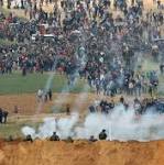 Clashes, 16 dead as thousands of Gazans march near Israel border