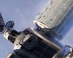 Image of Starliner spacecraft docking with the International Space Station