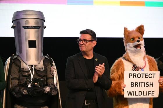 Count Binface, the man in a can with a plan, seeks Parliament seat in Britain's wackiest election; declares 'Game on, Nige' after Farage's witch-hunt claim