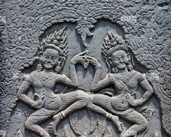 Intricate stone carvings of Apsara dancers at Angkor Wat.