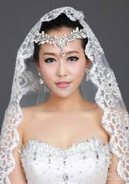 Image result for wedding tiaras with veils