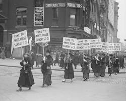 Image of women marching or protesting for the right to vote