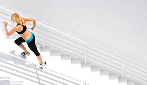 woman running stadium steps