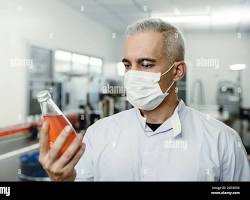 person inspecting a product for quality resmi
