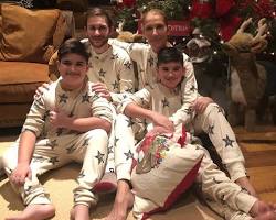 Image of Celine Dion with her sons, RenéCharles, Nelson, and Eddy