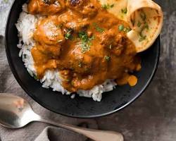 Image of Chicken Tikka Masala served with rice and naan