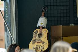 Signed guitars, shirts & more on sale for Morgan Wallen’s Michigan Stadium concerts