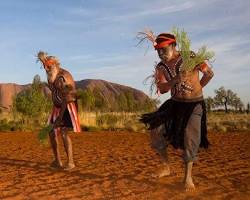 Anangu people performing a traditional dance at Uluru
